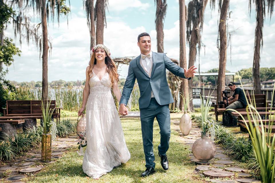 Couple walking down aisle