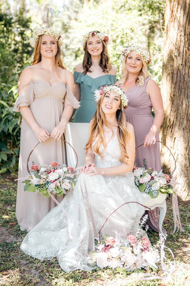 Bride and Bridesmaids looking at camera