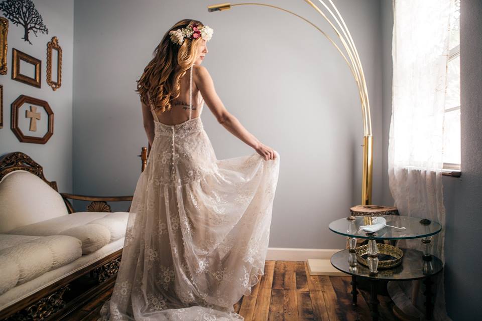 Bride holding dress
