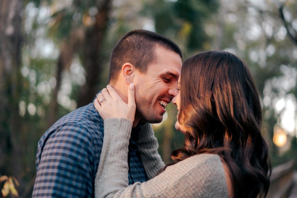 Engaged couple smiling on Florida trail