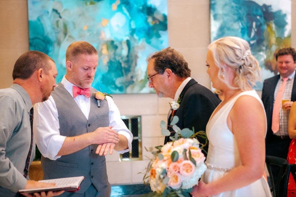 Groom and Father coin toss at DoveCote Wedding - Orlando