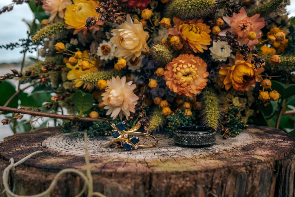 Wedding bouquet and rings at Knotted Roots on the Lake - Land O' Lakes