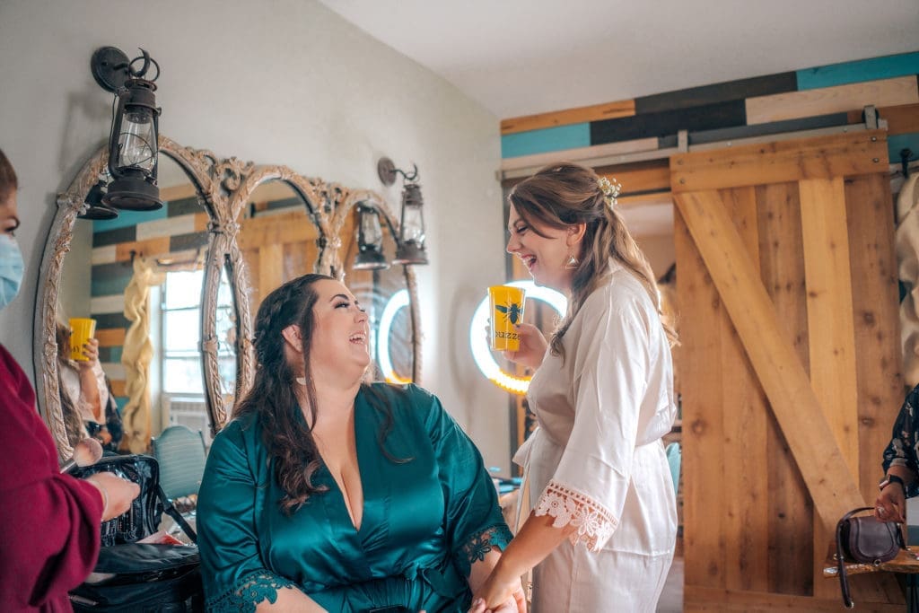 Bride and bridesmaid at Knotted Roots on the Lake - Land O' Lakes