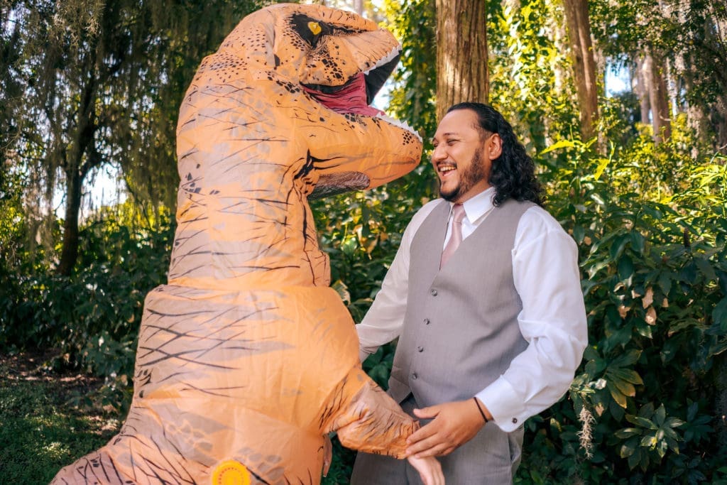 Bride dressed as Trex with Groom at Knotted Roots on the Lake